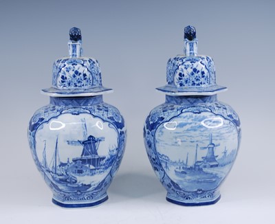 Lot 2065 - A pair of Royal Mosa blue and white urns, 20th...