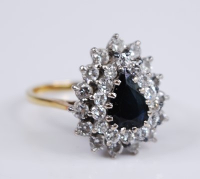 Lot 1153 - An 18ct yellow and white gold, sapphire and...