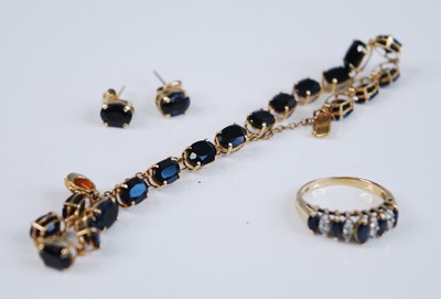 Lot 2173 - A yellow metal sapphire suite, comprising a...