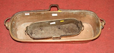 Lot 101 - A Victorian copper fish pan, width 68cm,...