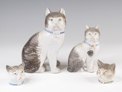 Lot 4053 - A Victorian Staffordshire model of a cat,...