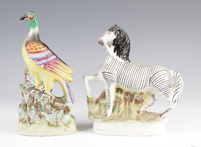 Lot 4060 - A Victorian Staffordshire model of a zebra,...