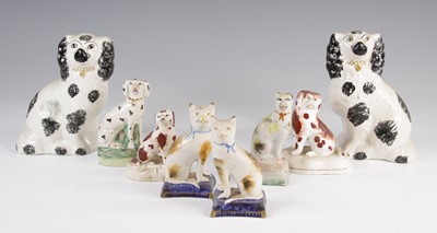 Lot 4049 - A pair of Victorian Staffordshire models of...