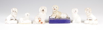 Lot 4055 - A Victorian Staffordshire model of a spaniel,...