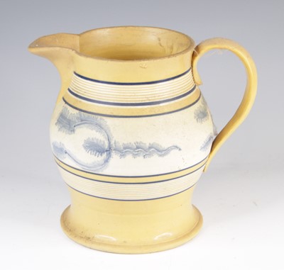 Lot 4018 - A mochaware jug, 19th century, decorated with...