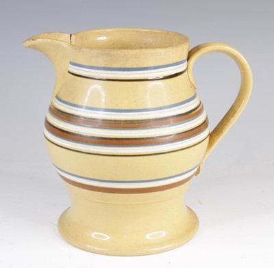 Lot 4022 - A mochaware jug, 19th century, decorated with...
