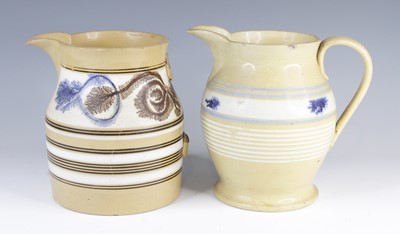 Lot 4016 - A mochaware jug, 19th century, decorated with...