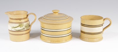 Lot 4020 - A mochaware milk jug, 19th century, decorated...