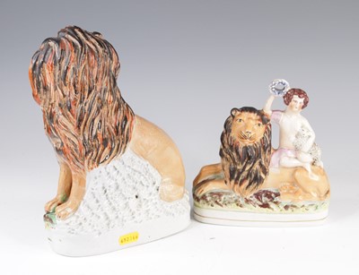 Lot 4061 - A Staffordshire model of a lion and a lamb,...