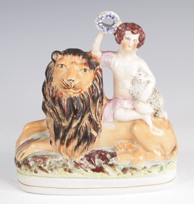 Lot 4061 - A Staffordshire model of a lion and a lamb,...