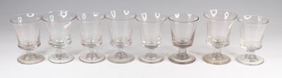 Lot 4093 - A matched set of eight Georgian glass rummers,...