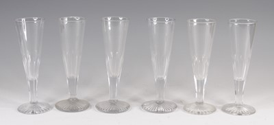 Lot 4087 - A matched set of six Georgian glass flutes,...
