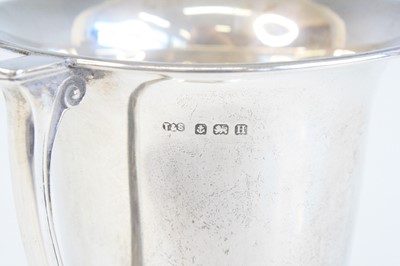 Lot 1249 - A George V silver trophy cup, of bell shaped...
