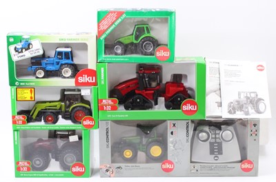 Lot 1646 - Siku 1/32nd scale boxed diecast and radio...