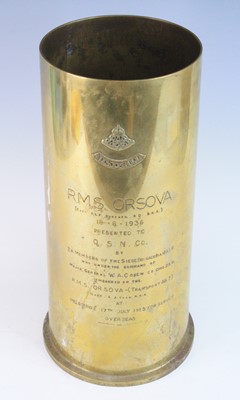 Lot 527 - A large brass shell case with applied Royal...