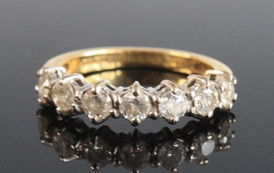 Lot 2747 - An 18ct yellow and white gold diamond...