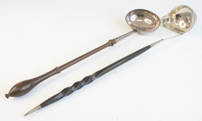 Lot 2086 - A George II silver toddy ladle, the bowl of...
