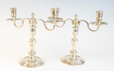 Lot 2097 - A pair of George VI silver twin-branch...