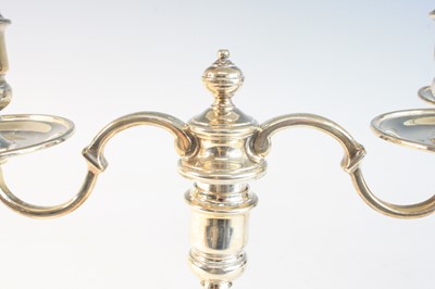Lot 2097 - A pair of George VI silver twin-branch...