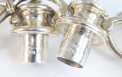 Lot 2097 - A pair of George VI silver twin-branch...
