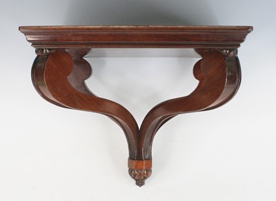 Lot 2383 - A mahogany clock bracket in the early...