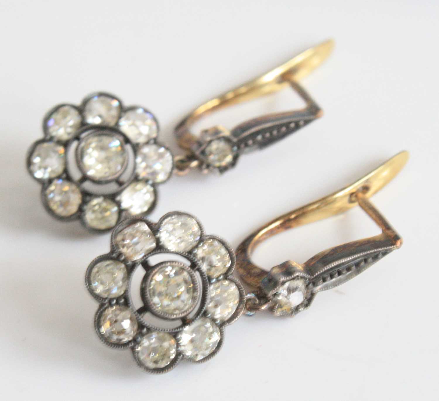 Lot 2180 - A pair of yellow and white metal diamond...