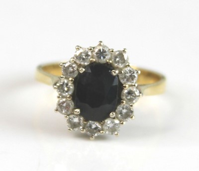 Lot 2159 - A yellow and white metal, sapphire and diamond...