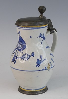 Lot 2046 - A Delft jug, 18th century, having a pewter lid...