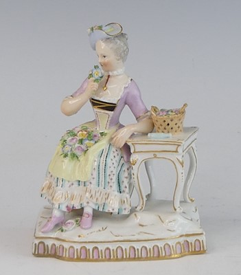 Lot 2055 - A Meissen porcelain figure of a lady, late...