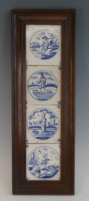 Lot 2048 - A set of four Delft blue and white tiles, 18th...