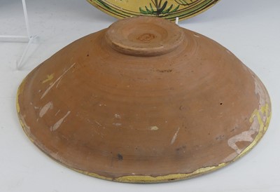 Lot 2043 - A matched pair of middle eastern slip glazed...