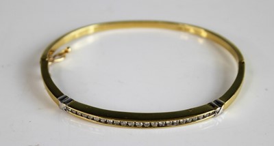 Lot 2161 - A yellow and white metal diamond hinged hollow...