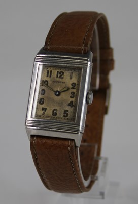 Lot 2209 - A gent's 1930s steel cased Reverso wristwatch,...