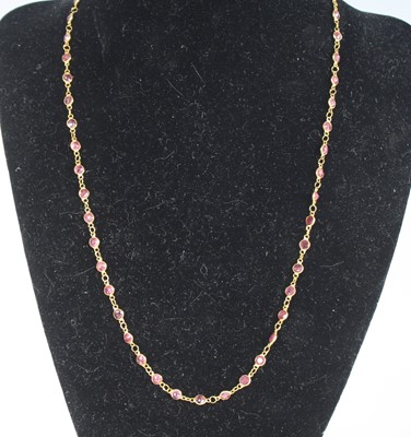Lot 2258 - A yellow metal ruby multi-stone necklace,...