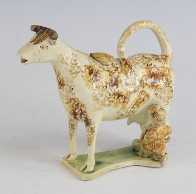 Lot 2071 - A Staffordshire or Yorkshire pearlware cow...