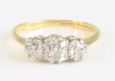 Lot 2275 - A yellow and white metal diamond three-stone...