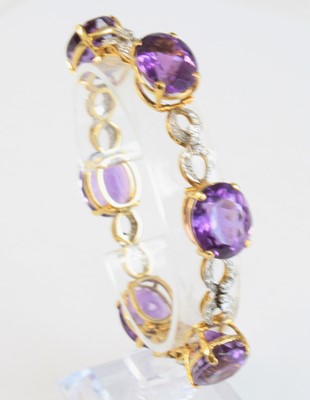 Lot 2262 - A yellow metal, amethyst and diamond bracelet,...