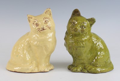 Lot 2092 - A near pair of Ewenny pottery models of cats,...