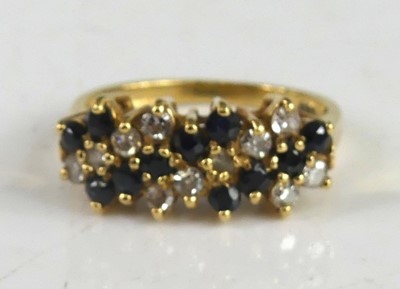 Lot 2251 - A yellow metal, sapphire and diamond six-row...