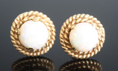 Lot 459 - A pair of yellow metal opal circular stud...