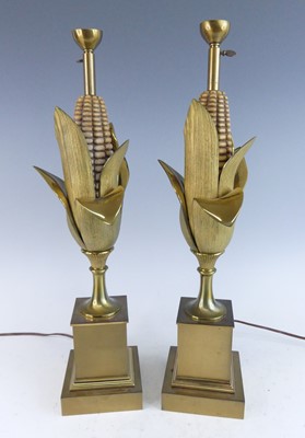 Lot 1221 - Maison Charles - a pair of gilt brass Epis de...