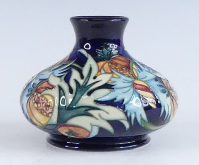 Lot 1031 - A Moorcroft Paradise Fruit pattern pottery...