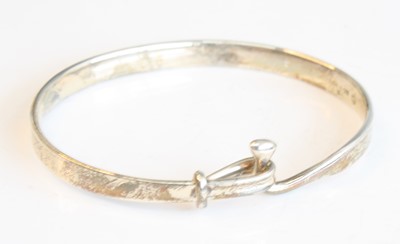 Lot 2517 - A silver Georg Jensen Torun bangle, featuring...
