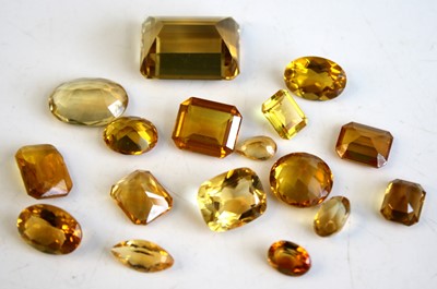 Lot 471 - A collection of loose vari-cut citrine stones,...