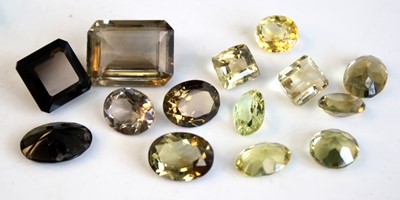 Lot 473 - A collection of loose vari-cut lemon and smoky...