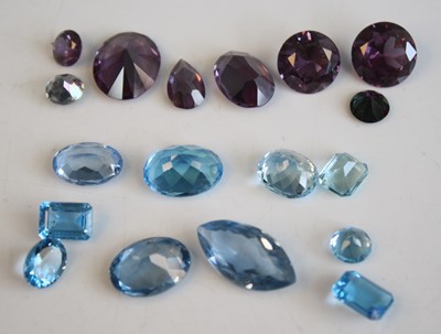 Lot 468 - A collection of loose vari-cut blue topaz and...