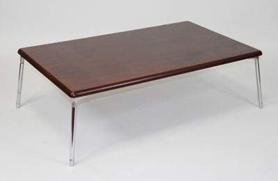 Lot 1422 - A 1970s rosewood low coffee table, the...