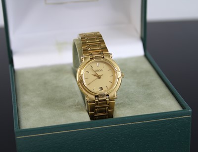 Lot 2313 - A lady's Gucci gold plated quartz wristwatch,...