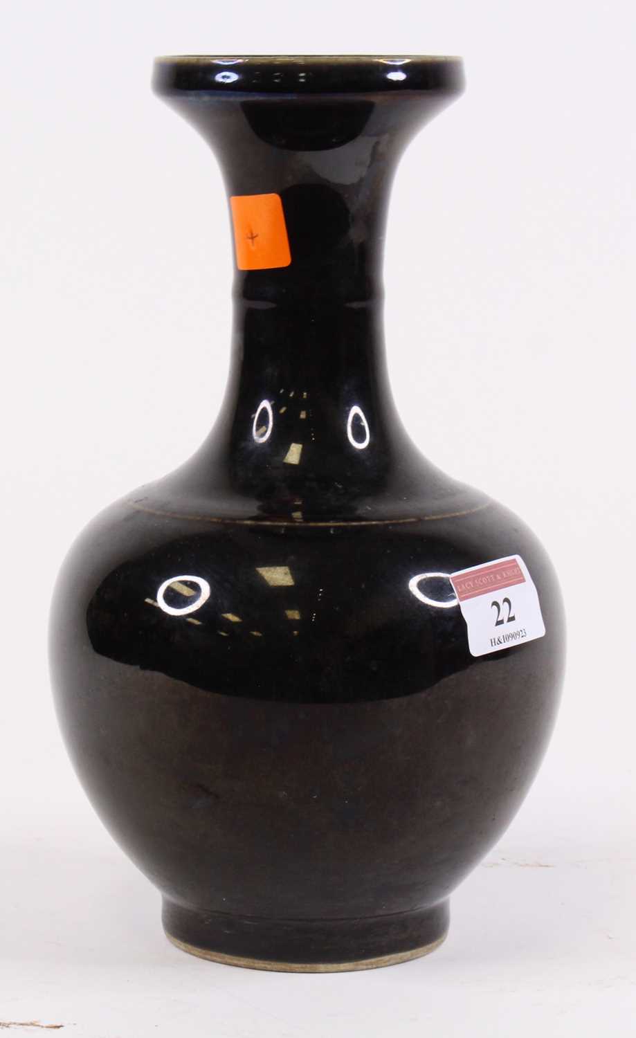 Lot 22 - A Chinese black glazed porcelain vase, six...