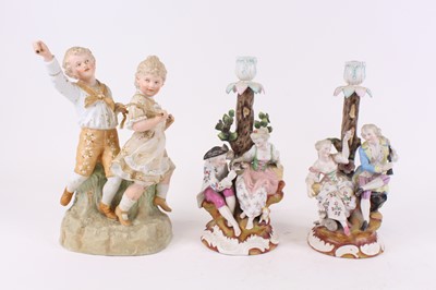 Lot 63 - A pair of German porcelain figural table...